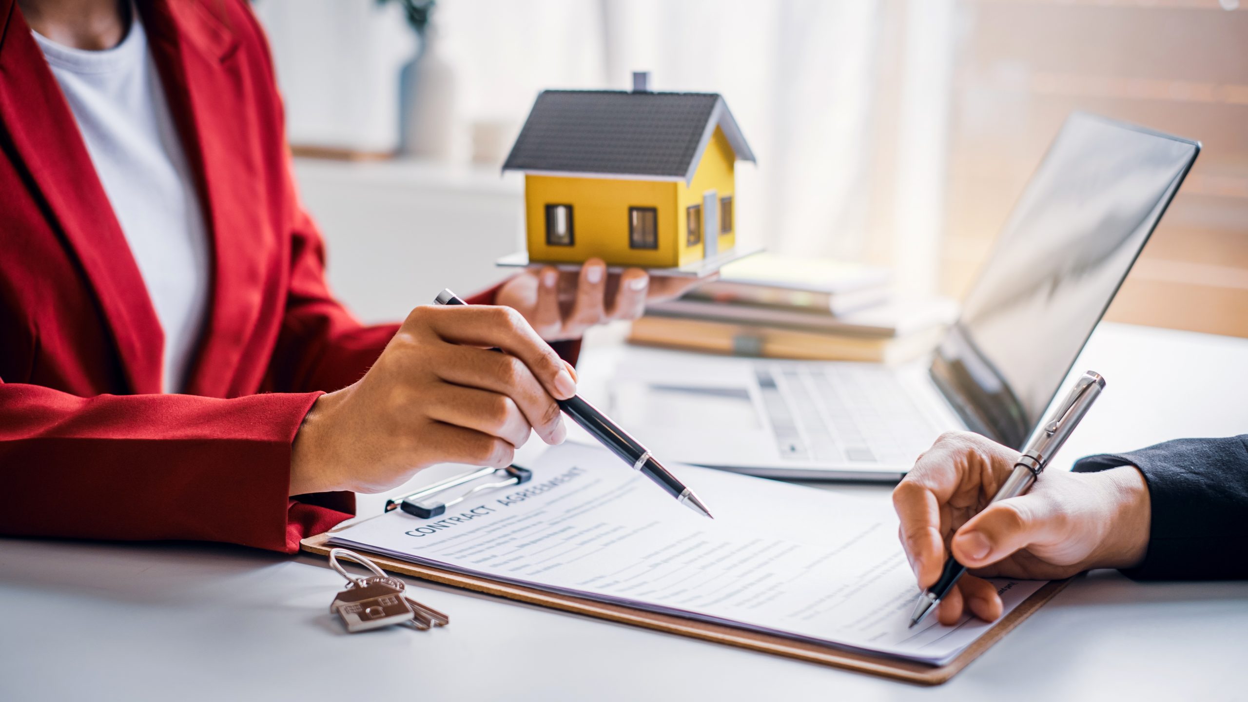 Contract signing with house model